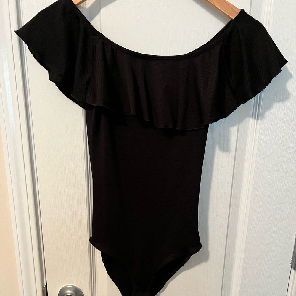 Black ruffle bodysuit. Size small. Worn once.